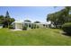 This home features impact windows, a sunroom, and a well maintained lawn at 5912 Driftwood Ave # 22, Sarasota, FL 34231