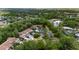 Overhead view of a lovely neighborhood with lush greenery and a tranquil pond at 6418 Rosefinch Ct # 103, Lakewood Ranch, FL 34202