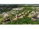 Aerial view of a community surrounded by lush green trees, ponds and mature landscaping at 6418 Rosefinch Ct # 103, Lakewood Ranch, FL 34202