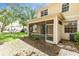 Backyard view of home with a screened-in porch and sliding glass doors at 6418 Rosefinch Ct # 103, Lakewood Ranch, FL 34202