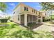 Backyard of home with a screened in porch and a view of the lawn at 6418 Rosefinch Ct # 103, Lakewood Ranch, FL 34202