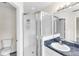 Clean bathroom featuring a glass shower and vanity with a framed mirror at 6418 Rosefinch Ct # 103, Lakewood Ranch, FL 34202