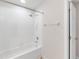 Clean bathroom with a white tiled shower and bathtub combination and a neutral color scheme at 6418 Rosefinch Ct # 103, Lakewood Ranch, FL 34202