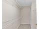 Walk-in closet with built-in shelving for optimal storage and organization at 6418 Rosefinch Ct # 103, Lakewood Ranch, FL 34202