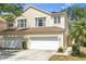 Charming two-story home featuring a two-car garage and well-manicured landscaping at 6418 Rosefinch Ct # 103, Lakewood Ranch, FL 34202