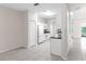 Bright kitchen with white cabinets, appliances, and neutral tile flooring at 6418 Rosefinch Ct # 103, Lakewood Ranch, FL 34202