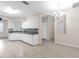 Bright kitchen featuring white cabinets, tile floors, and an open layout at 6418 Rosefinch Ct # 103, Lakewood Ranch, FL 34202