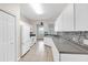 Kitchen with white cabinets, stainless steel appliances, and tile backsplash at 6418 Rosefinch Ct # 103, Lakewood Ranch, FL 34202