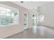 Bright living room with tile flooring, lots of natural light, and sliding glass door at 6418 Rosefinch Ct # 103, Lakewood Ranch, FL 34202