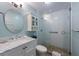 Modern bathroom features a glass-enclosed shower, a pebble floor, and modern fixtures at 6500 Flotilla Dr # 126, Holmes Beach, FL 34217