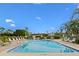 Enjoy the spacious outdoor pool with plenty of lounge chairs for relaxing in a sunny resort-style community setting at 6500 Flotilla Dr # 126, Holmes Beach, FL 34217