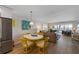 Dining area with views into the living room and large windows overlooking bay waters at 6500 Flotilla Dr # 126, Holmes Beach, FL 34217
