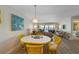 Dining area with a view into the living room with incredible views of the bay waters at 6500 Flotilla Dr # 126, Holmes Beach, FL 34217