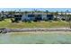 Waterfront condo with large windows and a grassy lawn at 6500 Flotilla Dr # 126, Holmes Beach, FL 34217