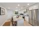 Beautiful kitchen featuring white cabinets, stainless steel appliances, and a center island at 6500 Flotilla Dr # 126, Holmes Beach, FL 34217