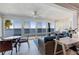 Bright sunroom with expansive windows offering panoramic views of the bay waters at 6500 Flotilla Dr # 126, Holmes Beach, FL 34217