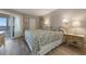 Inviting main bedroom with balcony access, soft lighting, and neutral color scheme, creating a peaceful retreat at 6500 Flotilla Dr # 126, Holmes Beach, FL 34217