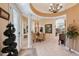 Open-concept dining room featuring tile floors, columns, and a chandelier at 6642 Oakland Hills Dr, Lakewood Ranch, FL 34202