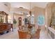 Bright dining room with decorative details and a glass table at 6642 Oakland Hills Dr, Lakewood Ranch, FL 34202