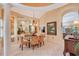 Elegant dining room with neutral walls, tile floors and decorative chandelier at 6642 Oakland Hills Dr, Lakewood Ranch, FL 34202