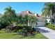 Beautiful single-story home featuring a well-maintained lawn, manicured landscaping, and a two-car garage at 6642 Oakland Hills Dr, Lakewood Ranch, FL 34202