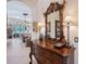 Foyer featuring tiled flooring, an ornate mirror, and a glimpse into the living area at 6642 Oakland Hills Dr, Lakewood Ranch, FL 34202