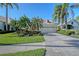 Charming single-story home featuring a paver driveway, two-car garage, and meticulously maintained landscaping at 6642 Oakland Hills Dr, Lakewood Ranch, FL 34202