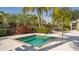 Close up of an inviting hot tub with tropical landscaping, offering a relaxing retreat at 6642 Oakland Hills Dr, Lakewood Ranch, FL 34202