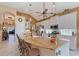 The kitchen features white cabinets, granite countertops, and an island at 6642 Oakland Hills Dr, Lakewood Ranch, FL 34202