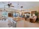 Open concept kitchen with an island flowing into the living area at 6642 Oakland Hills Dr, Lakewood Ranch, FL 34202