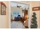 View of a home office with hardwood floors, a patterned rug, and arched windows at 6642 Oakland Hills Dr, Lakewood Ranch, FL 34202