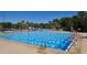 Outdoor swimming pool with blue and white lane dividers and starting blocks, surrounded by lounge chairs at 6642 Oakland Hills Dr, Lakewood Ranch, FL 34202