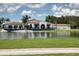 Picturesque clubhouse with covered outdoor patio, ideal for lakeside dining and events at 7408 S Serenoa Dr, Sarasota, FL 34241