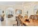 Dining room with decorative rug, chandelier and seamless access to living areas at 7408 S Serenoa Dr, Sarasota, FL 34241