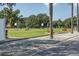 A well-maintained driving range offers a relaxing experience surrounded by lush greenery and a bright blue sky at 7408 S Serenoa Dr, Sarasota, FL 34241