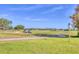 Scenic golf course view with well-manicured greens and golfers enjoying a sunny day at 7408 S Serenoa Dr, Sarasota, FL 34241