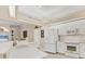 Bright kitchen with modern appliances and breakfast bar overlooking the living area at 7408 S Serenoa Dr, Sarasota, FL 34241