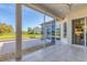 Screened lanai offers a perfect spot to relax with views of the lush landscaping at 7408 S Serenoa Dr, Sarasota, FL 34241