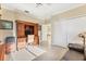 Bright office space featuring wood furniture, neutral walls, and neutral tiled flooring at 7408 S Serenoa Dr, Sarasota, FL 34241