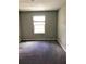 Simple bedroom featuring neutral walls, carpet and a window for natural light at 7631 French Marigold Ave, Tampa, FL 33619