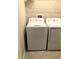 Laundry room featuring a white washing machine and a dryer at 7631 French Marigold Ave, Tampa, FL 33619