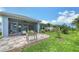 Lovely backyard showcasing a brick paver patio, screened lanai, and well-maintained lawn at 8110 Trimbelle Ter, Parrish, FL 34219
