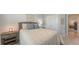 Bedroom with soft, neutral decor, including a comfortable bed and matching nightstands, exudes a serene ambiance at 8110 Trimbelle Ter, Parrish, FL 34219