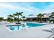 Inviting community pool featuring ample lounge chairs, modern design, and well-maintained landscaping at 8110 Trimbelle Ter, Parrish, FL 34219