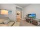 Home office with a comfortable seating area, smart TV, and ample space, blending functionality with style at 8110 Trimbelle Ter, Parrish, FL 34219