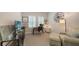 Comfortable home office with neutral decor, plush seating, and abundant natural light, with a dedicated workspace at 8110 Trimbelle Ter, Parrish, FL 34219