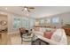 Bright living room with comfortable seating, stylish decor, and natural light at 8110 Trimbelle Ter, Parrish, FL 34219