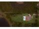Aerial view of a home with a pool, surrounded by lush landscaping and a large backyard at 8223 Snowy Egret Pl, Bradenton, FL 34202