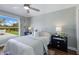 Comfortable bedroom with a large window offering backyard views and lots of natural light at 8223 Snowy Egret Pl, Bradenton, FL 34202