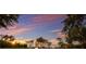 Charming single-story home with manicured lawn, professional landscaping, and sunset views at 8223 Snowy Egret Pl, Bradenton, FL 34202